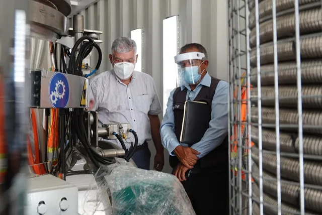 Men checking equipment.jpg