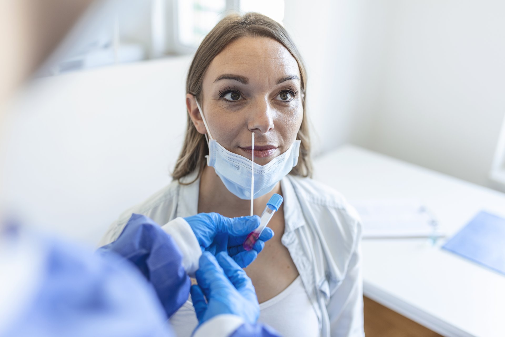 doctor-nurse-taking-pcr-nasal-swab-test-from-pregnant-woman-covid-19-vaccination-concept.jpg